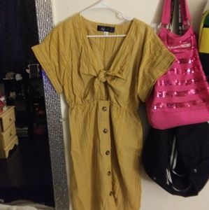 Blue Rain mustard striped cutout dress.